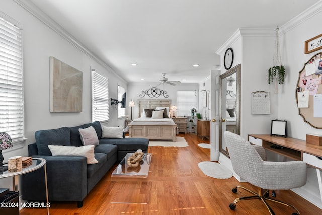 bedroom with ornamental molding and light hardwood / wood-style flooring