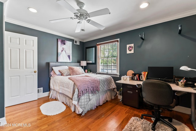 bedroom with light hardwood / wood-style flooring, ornamental molding, and ceiling fan