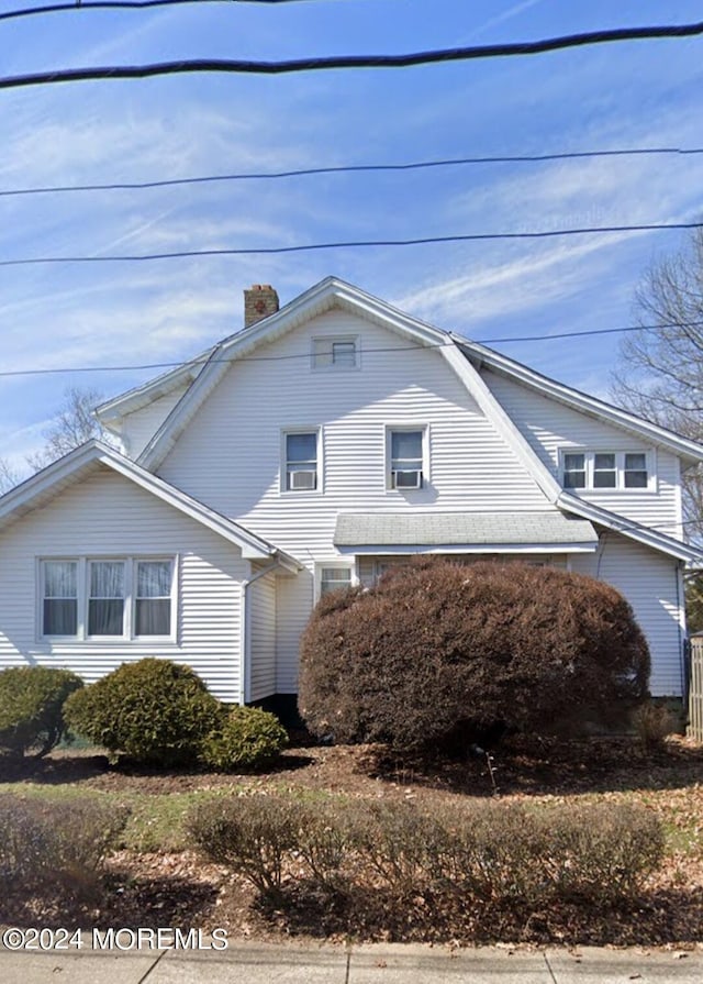 133 Degraw Ave, Teaneck, NJ 07666 - view of front of home with a gambrel roof and a chimney