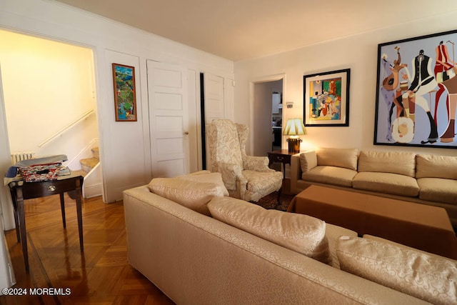 living room featuring parquet floors