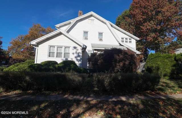 133 Degraw Ave, Teaneck, NJ 07666 - view of front of home with a gambrel roof and a chimney