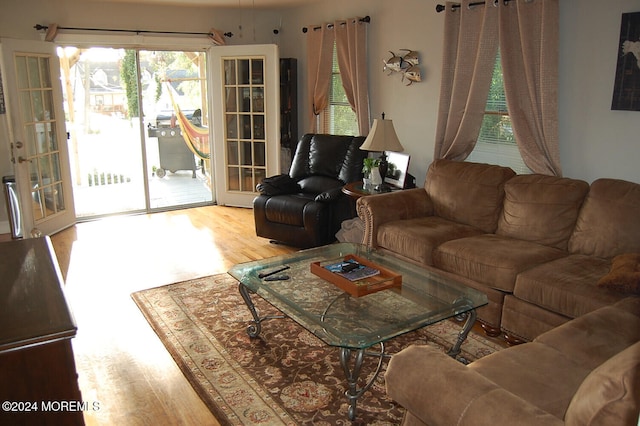 living room with french doors and hardwood / wood-style flooring