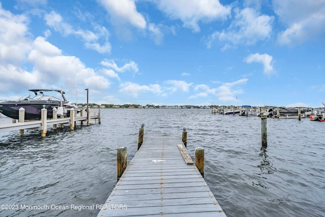 view of dock with a water view