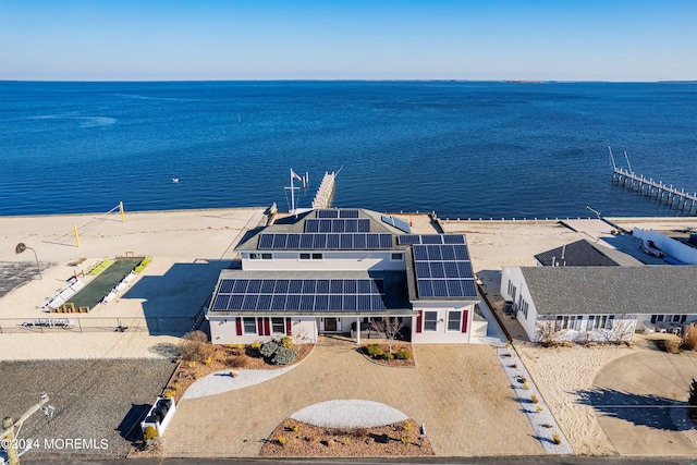 bird's eye view featuring a water view and a view of the beach