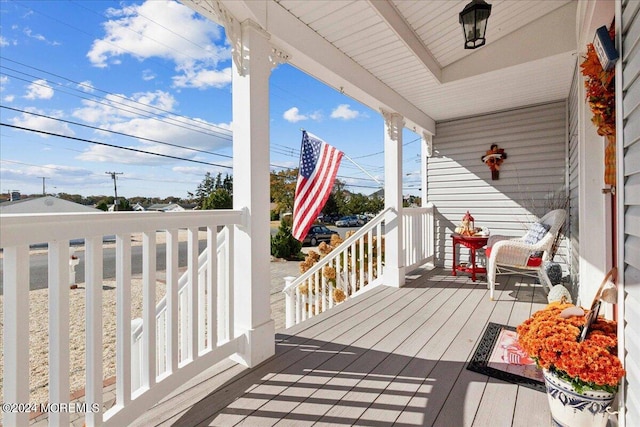 wooden terrace featuring a porch