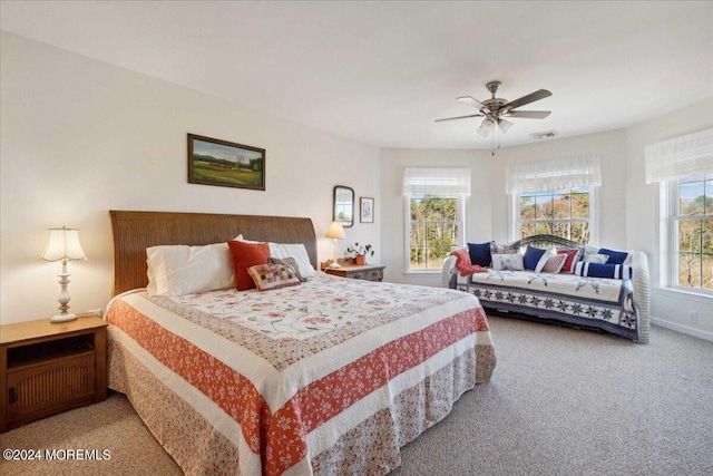 bedroom featuring ceiling fan and carpet