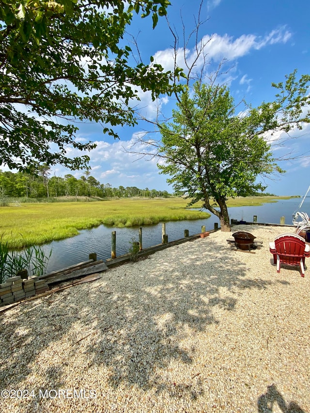 view of water feature featuring an outdoor fire pit