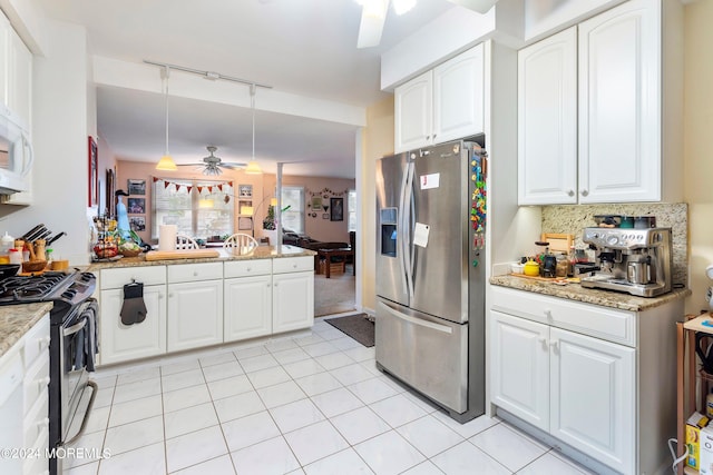 kitchen with hanging light fixtures, light stone countertops, white cabinetry, appliances with stainless steel finishes, and ceiling fan