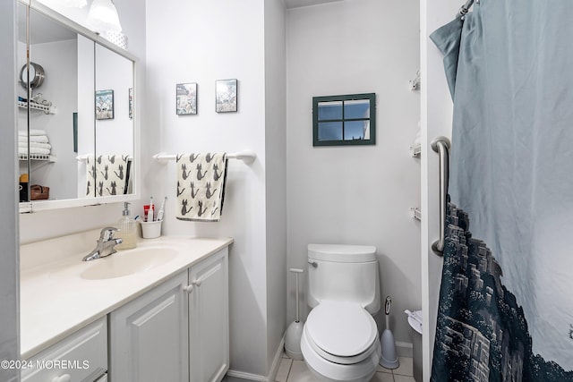 bathroom featuring vanity, toilet, and tile patterned floors