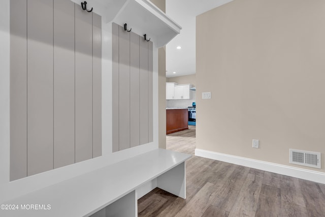 mudroom with light hardwood / wood-style flooring