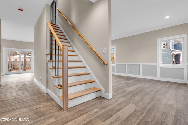 stairs with hardwood / wood-style flooring