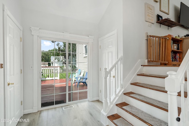 staircase featuring hardwood / wood-style floors