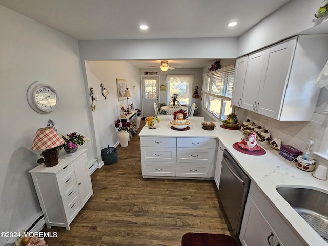 kitchen featuring kitchen peninsula, white cabinets, tasteful backsplash, dishwasher, and dark wood-type flooring