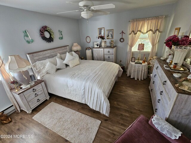 bedroom with dark wood-type flooring and ceiling fan