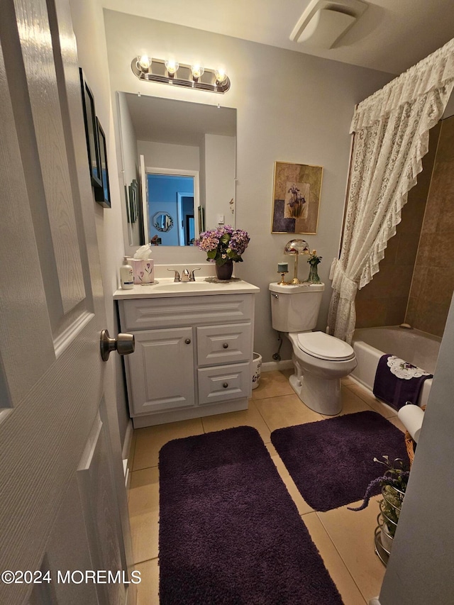 full bathroom featuring toilet, shower / bath combo, vanity, and tile patterned floors