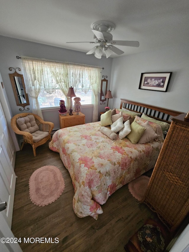 bedroom featuring ceiling fan and dark hardwood / wood-style flooring