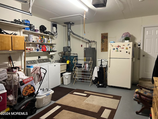 interior space with water heater, white fridge, washer and dryer, and a garage door opener