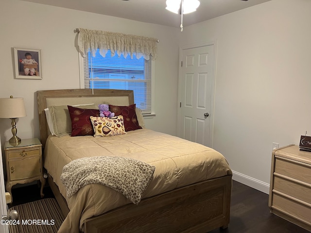 bedroom featuring dark hardwood / wood-style flooring