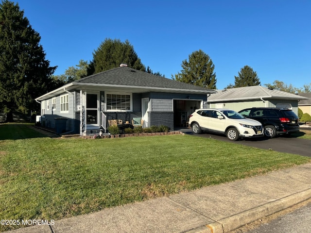 ranch-style house with a front lawn