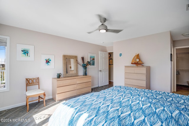 bedroom with dark hardwood / wood-style floors and ceiling fan