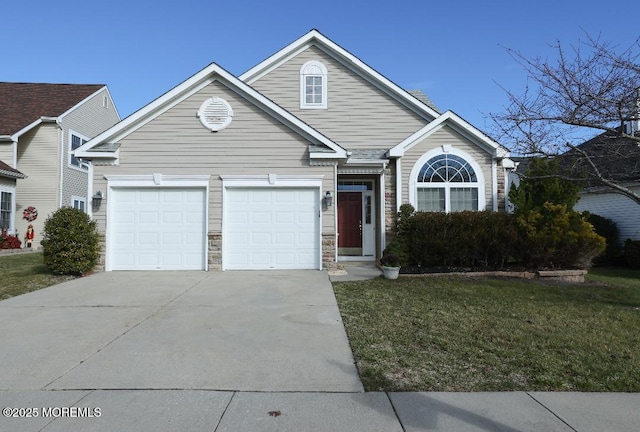 view of front of property with a front lawn and a garage