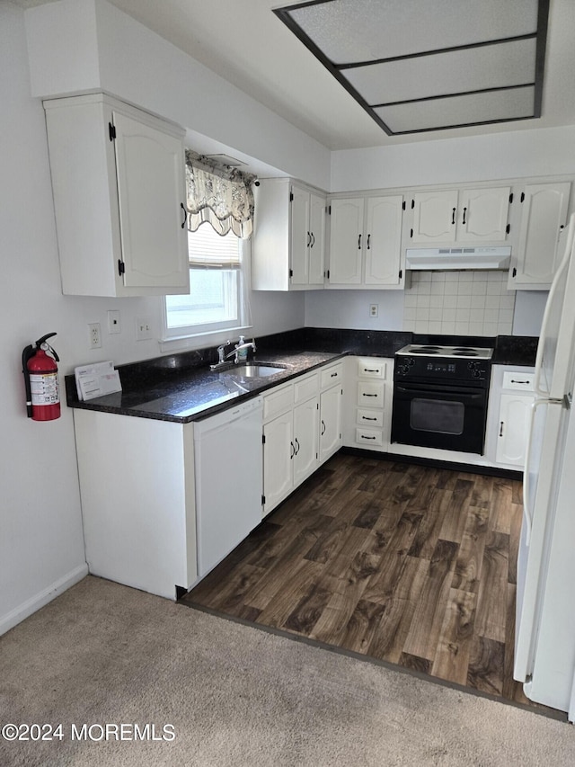 kitchen featuring white cabinets, sink, dark wood-type flooring, and white appliances