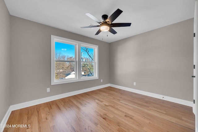 empty room featuring ceiling fan and light hardwood / wood-style flooring