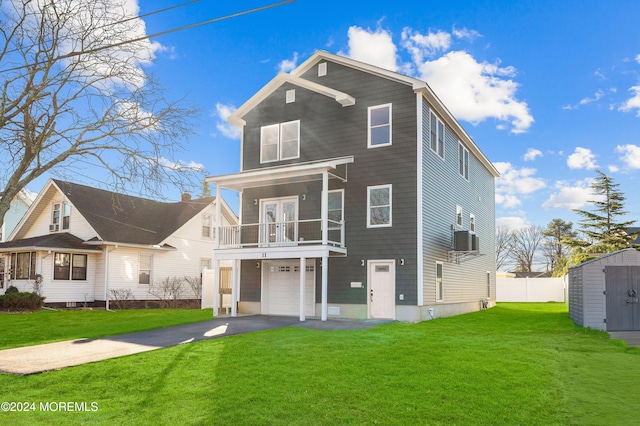 back of house featuring cooling unit, a garage, a yard, and a balcony