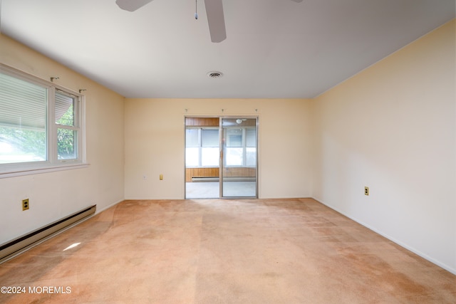 spare room with ceiling fan, a baseboard radiator, and light colored carpet