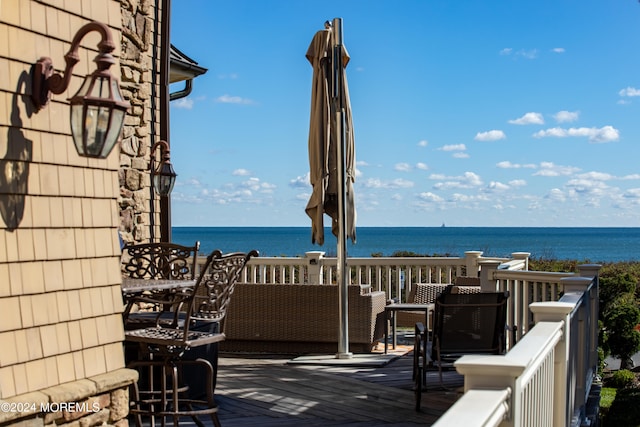 deck featuring a water view