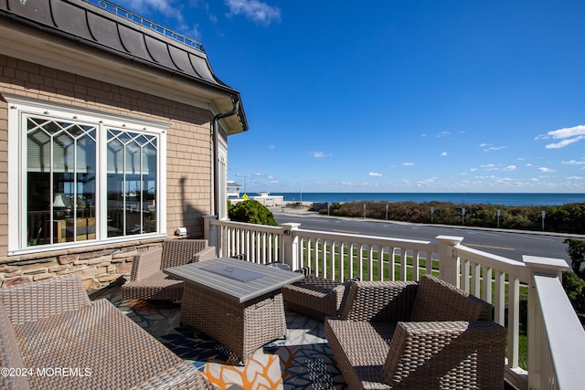 wooden deck with a water view