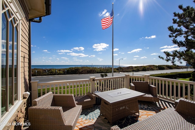 deck featuring a water view