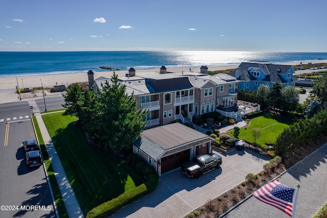 aerial view featuring a water view and a beach view