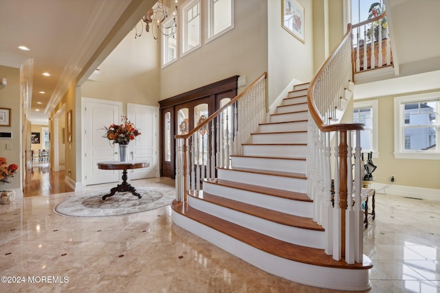 1805 Ocean Ave, Spring Lake, NJ 07762 - foyer featuring a high ceiling, marble tiled flooring, stairway, ornamental molding, and baseboards