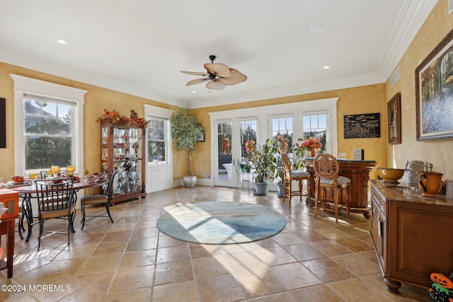 interior space featuring french doors, ceiling fan, sink, and crown molding