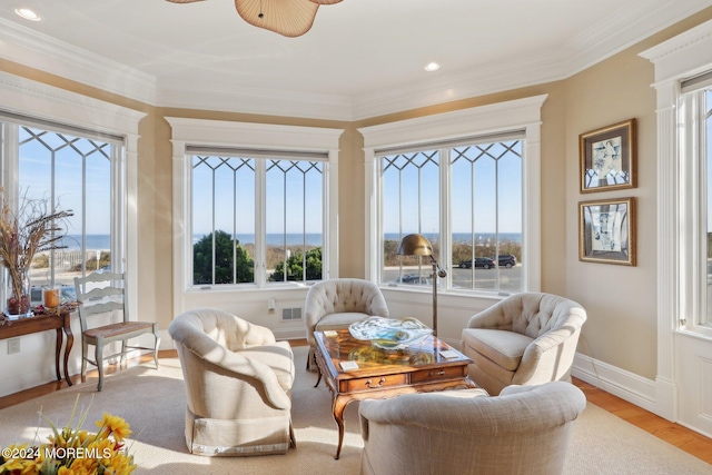 sunroom featuring ceiling fan