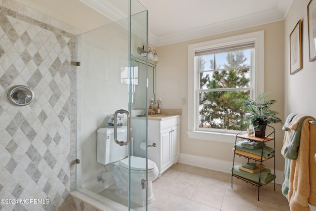 bathroom featuring tiled shower, toilet, tile patterned flooring, crown molding, and vanity