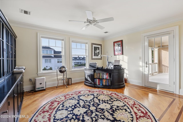 office area with light hardwood / wood-style flooring, ornamental molding, and ceiling fan