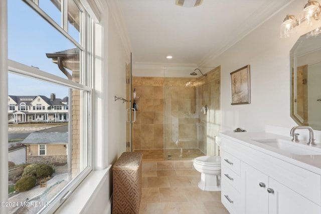 bathroom featuring toilet, ornamental molding, vanity, an enclosed shower, and tile patterned flooring