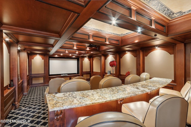 cinema with crown molding, coffered ceiling, carpet, and beamed ceiling