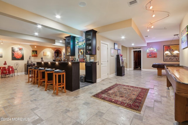 interior space with pool table and pendant lighting