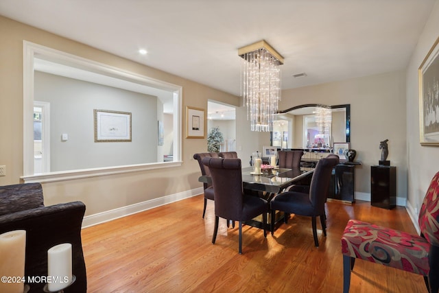 dining area with light hardwood / wood-style floors