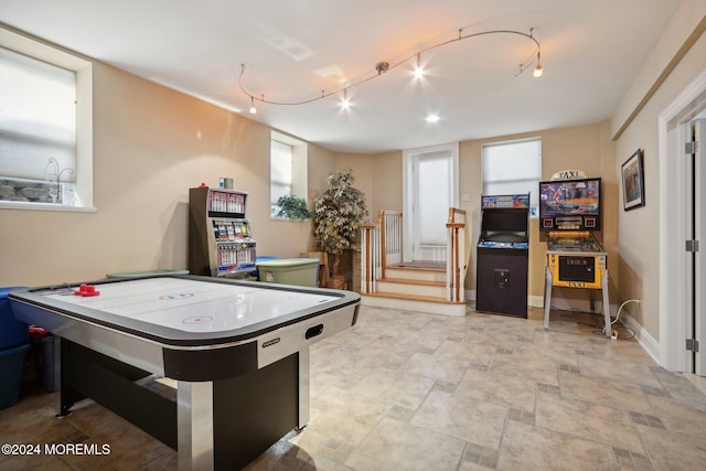 game room with rail lighting