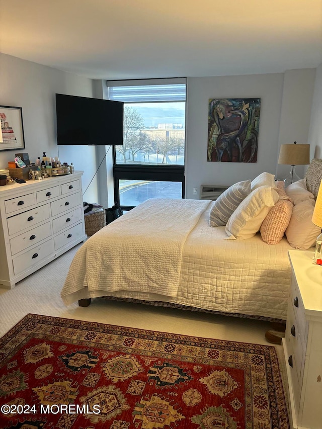 bedroom with light colored carpet