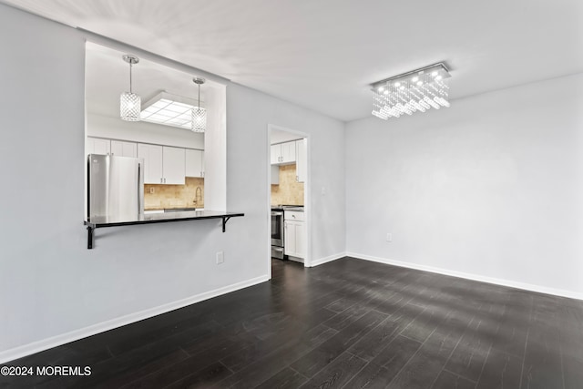 unfurnished living room with dark hardwood / wood-style floors and sink