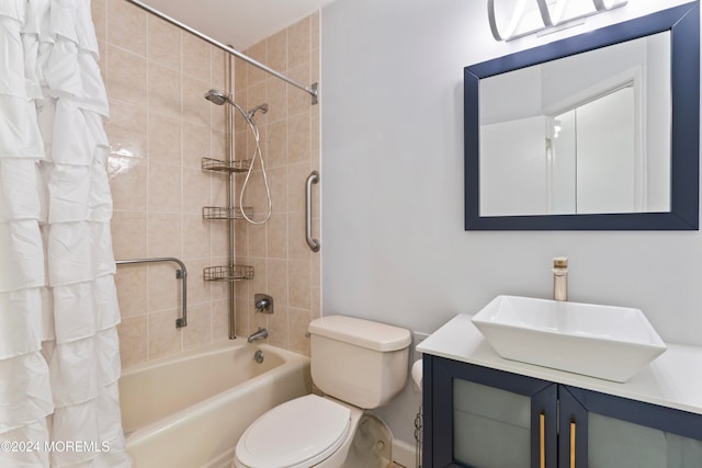 full bathroom featuring vanity, toilet, and shower / tub combo