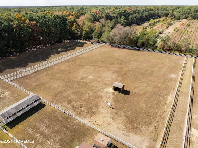 birds eye view of property with a rural view