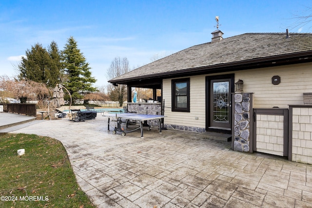 view of patio / terrace featuring a pool