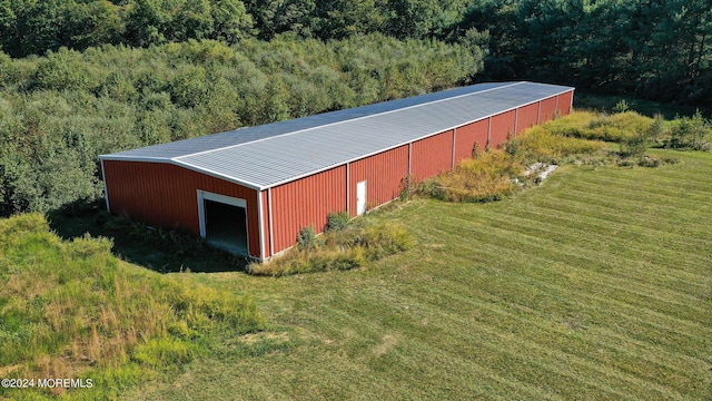 view of outbuilding with a yard