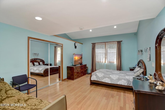 bedroom with light hardwood / wood-style flooring and a closet